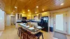 The openness of the kitchen makes it easy to chat with friends or family while cooking, or to catch the glow of the fire and the sound of laughter as you move between the rooms.