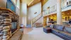 Natural light pours in through large windows, tying it all together with a view of the forest just beyond.