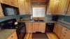 This kitchen is equipped with everything you might need to cook a home cooked meal.