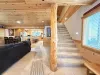 View of the stairs and the open living room and kitchen.