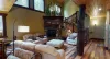 Upon entrance you are greeted by the living room with a fireplace and seating.