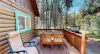 Deck area with table and chairs to enjoy the scenery.