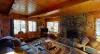 The living room offers a cozy space to unwind after a long day. A fireplace is included be sure to bring your own wood.