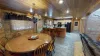 View the kitchen from the dining area with the open concept of the cabin.