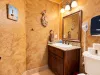 Half bathroom located on the main level across from the laundry room.