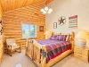 Private bedroom upstairs with a queen size bed.