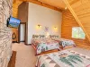 Loft area overlooking the water. 3 queen beds with lots of natural light.