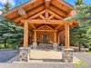 Beautiful front entrance of the cabin. Covered pull through drive.