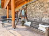 Sit back and relax on the swing while your family places on the large lawned back yard overlooking the water.