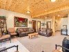 Downstairs living area with fireplace and seating.