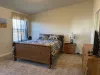Master bedroom with a Queen size bed.