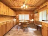 Dining room table located near the kitchen for easy access.