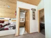 From the stairs you can view the loft beds, bathrooms, and entrance to the bedrooms.
