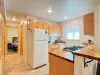 Kitchen leads into the hallway with the bathroom on the right and master bedroom strait back.