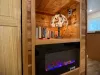 Electric fireplace with some books and games.