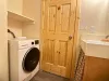 Bathroom with Washer/Dryer combo unit. This does both jobs.