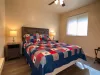 Master bedroom with a queen bed.
