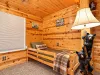 This is a spacious bedroom on the main level with a queen bed and a nook with a twin bed.