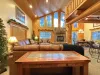 Natural light pours in through large windows, tying it all together with a view of the forest just beyond.