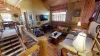 Upstairs living are with seating and tv for entertainment.