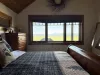 Master bedroom with stunning meadow views.