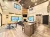 Dining room area with seats for 8 with additional seating at the kitchen island.