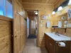 A cabin bathroom feels like a little retreat within a retreat—warm, earthy, and connected to nature in the most calming way.