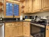 It’s the kind of kitchen where a pot of chili simmers while someone pours hot cider, and the sound of laughter echoes through the rafters. A mix of rugged charm and functional elegance.