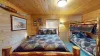 Bedroom #3 located upstairs with a Queen and a twin bed.