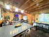 The open kitchen blends seamlessly into the cabin's cozy living area, creating a welcoming space perfect for gathering and unwinding.