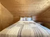 Bedroom #4 located upstairs with a Queen size bed.