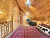 Upstairs loft with 2 queen beds to comfortably sleep 4 people.