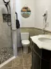 1st bathroom downstairs with walk-in shower, toilet, and sink.