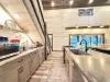 Very open kitchen with appliances, pots and pans, basic cooking essentials, dishes, and utensils.