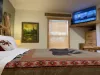 The room brings in natural light from the window to enjoy the beautiful view of the cabin.