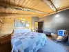 This beautiful king bedroom brings modern charm to a rustic cabin.