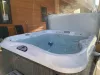 Hot tub located on the back deck to use during your stay.