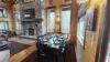 A full size dining table that seats up to 8 people. Additional seating is available at another table and the kitchen island.