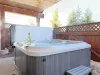 Relax after a long day in the hot tub located through the back door.