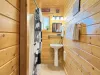 A cabin bathroom feels like a little retreat within a retreat—warm, earthy, and connected to nature in the most calming way.