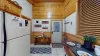 The entryway to the cabin leads you right into the kitchen and the bedroom to the right.