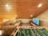In the loft sits a solid foosball table—wood finish to match the cabin vibes, but sturdy enough for serious tournament play.
