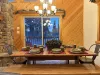 Dining table located across from the kitchen with seating for up to 8 people. Additional seating is also available at the island with 4 more seats.