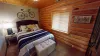 Bedroom 2 located upstairs with a Queen size bed.