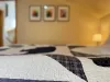 This bedroom feels like a serene sanctuary, offering a peaceful escape surrounded by nature.