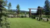 This cabin is nestled in Yellowstone Lux that is full of greenery.