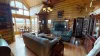 Living room with large open windows illuminating the room.