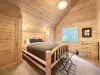 Queen size bed with dresser for storage.