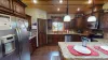 Beautiful kitchen equipped with stainless steel appliances, pots and pans, dishes, silverware, and basic cooking essentials.