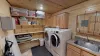 Mud room with full size washer and dryer. Laundry soap is provided.